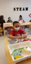 Student using braille legos