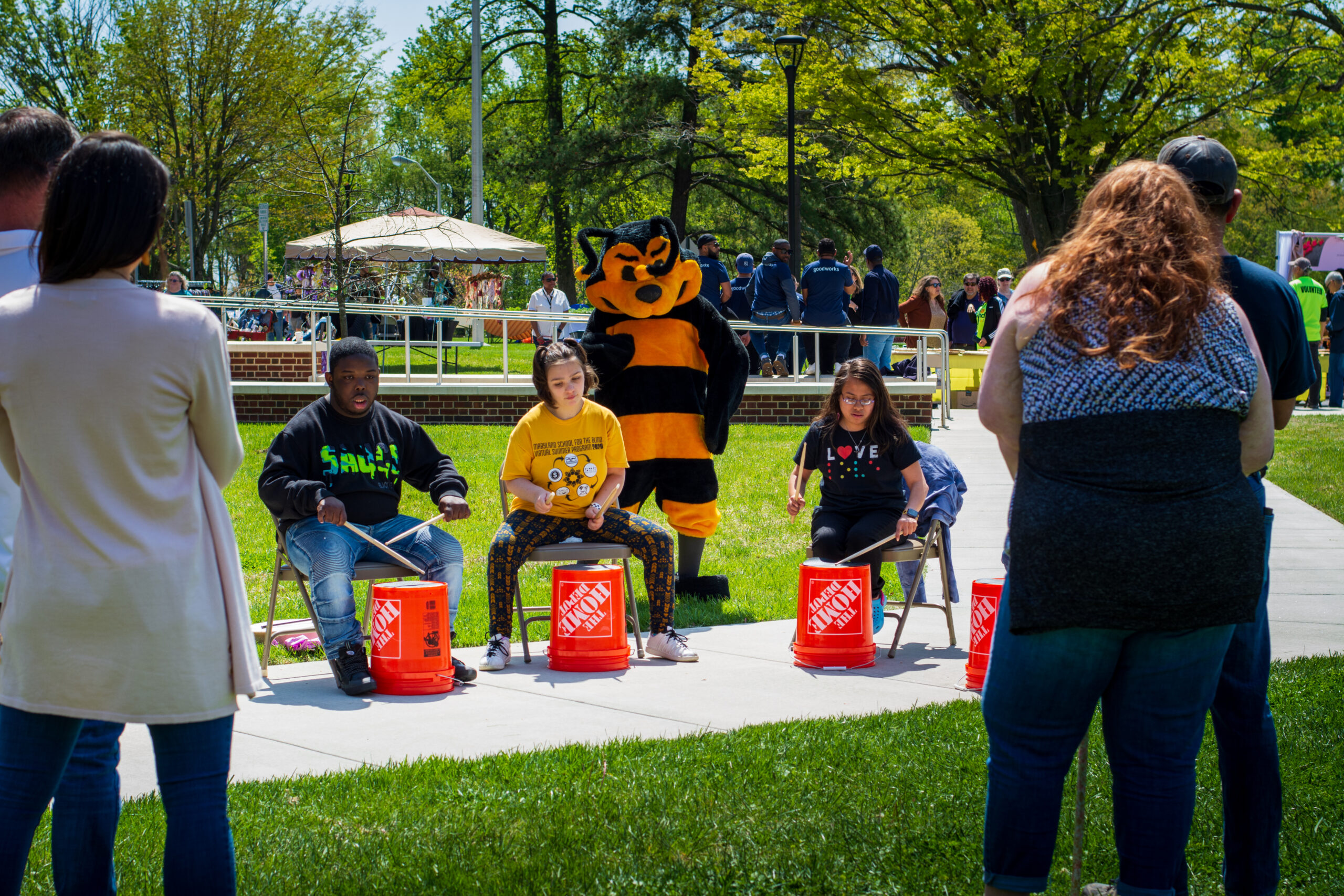 Students drummers with the Bee mascot