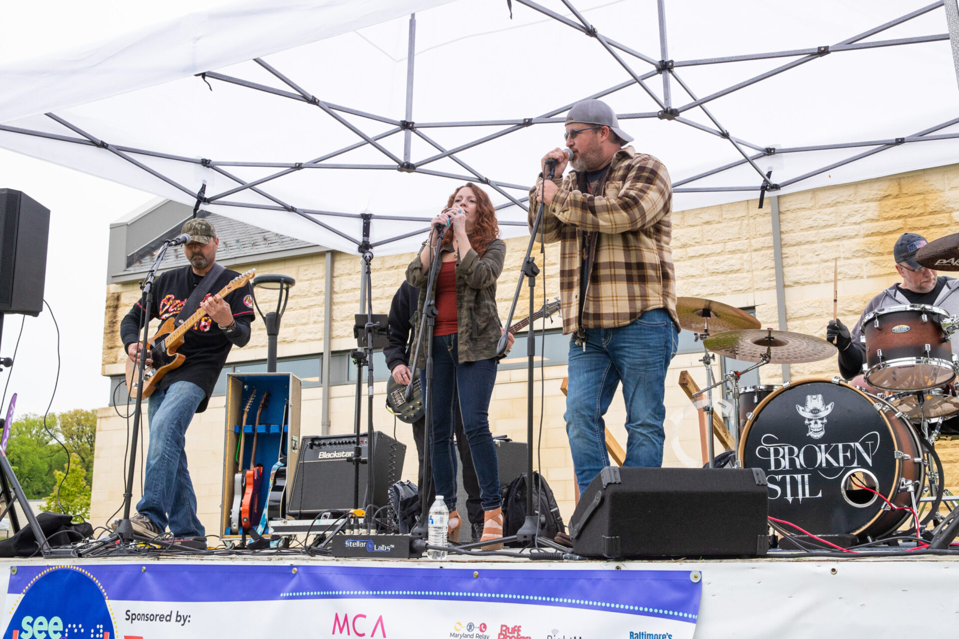 Broken Stil band performing on a stage Broken Stil band performing on a stage