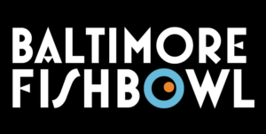 Text reads 'Baltimore Fishbowl' in bold white letters on a black background, with the second 'O' designed as a blue circle with an orange dot.
